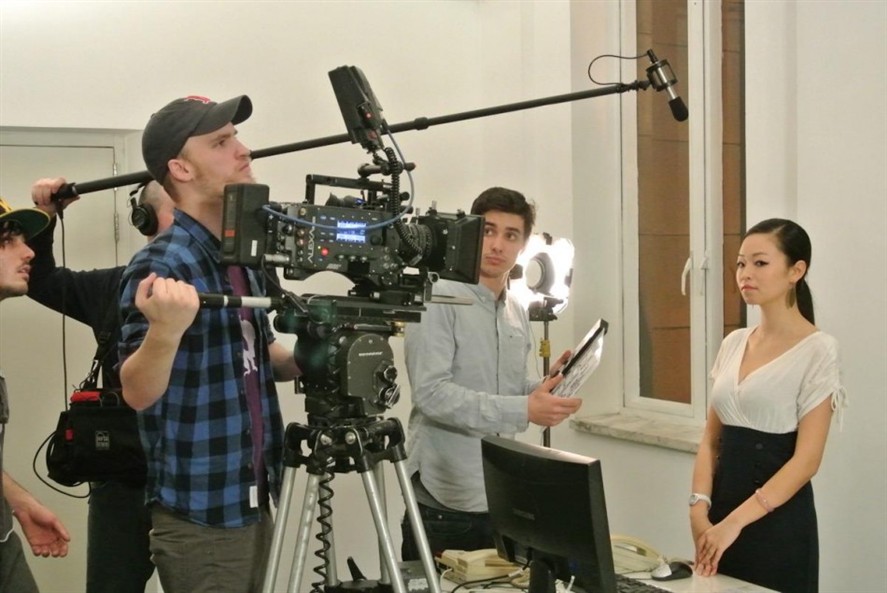 Dalian production team discussing a brief near a location setup