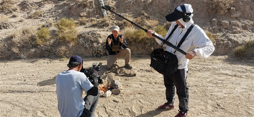 Dalian crew members discussing a shoot plan