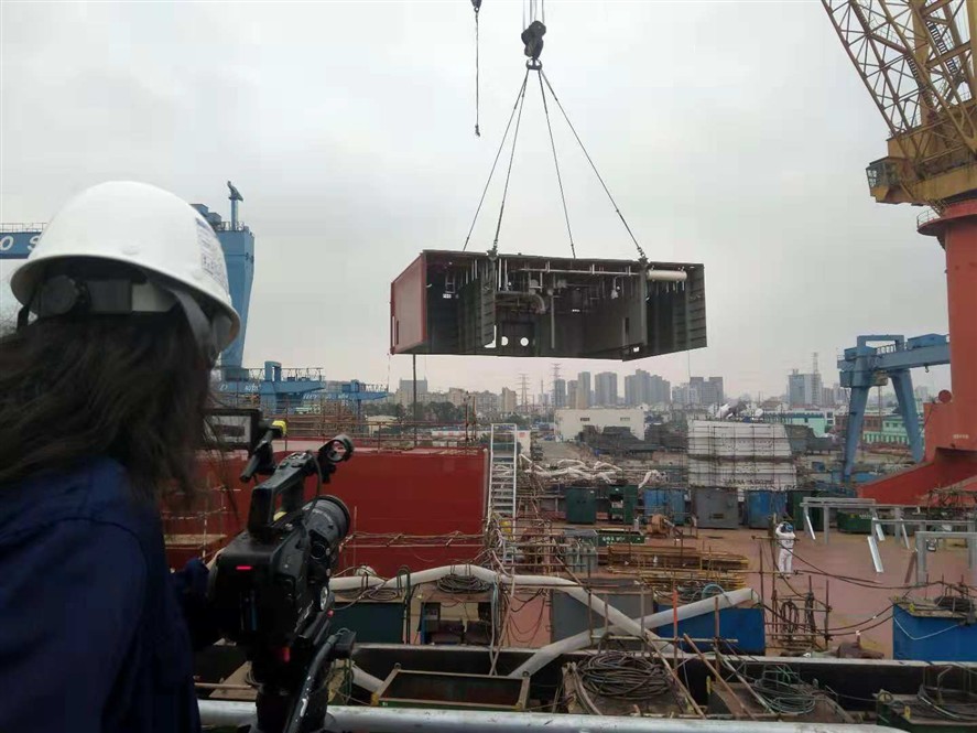 Dalian production crew coordinating a local shoot